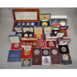 A boxed quantity to include coins & medallions from around the world, some Royal Mint