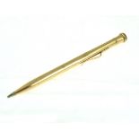 A yellow metal propelling pencil stamped 9ct, engraved W. H. A. J. 17.9g. 13cm long.