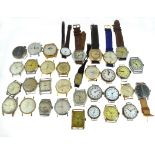 A boxed quantity of mechanical watch heads, some silver, most A/F