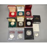 A boxed quantity of foreign silver proof coins/medallions to include £1 Australian Kookaburra, $10