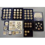 A boxed quantity of commemorative coins/medallions to include forty eight boxed $1 Dollar Cook