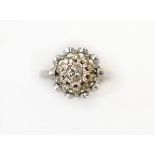 A diamond cluster ring H/M 18ct, the eleven round brilliant cut diamonds total approx 0.35cts (