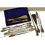 A cased set of button hooks & shoe horn H/M Birmingham 1912 together with thirteen assorted silver
