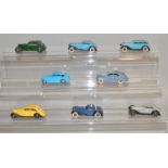 7 unboxed Dinky Toys including 36c Humber and 40b Triumph together with a French Dinky Peugeot