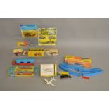 5 boxed vintage diecast models by Corgi, Dinky and Budgie, all playworn to varying degrees,