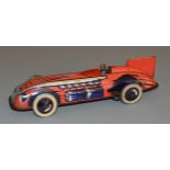 An unboxed Wells Brimtoy vintage tinplate 'Land Speed Record Car', with operational clockwork