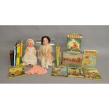 A mixed group of toys and Annuals including two porcelain headed Dolls, a vintage boxed 'Escalado'