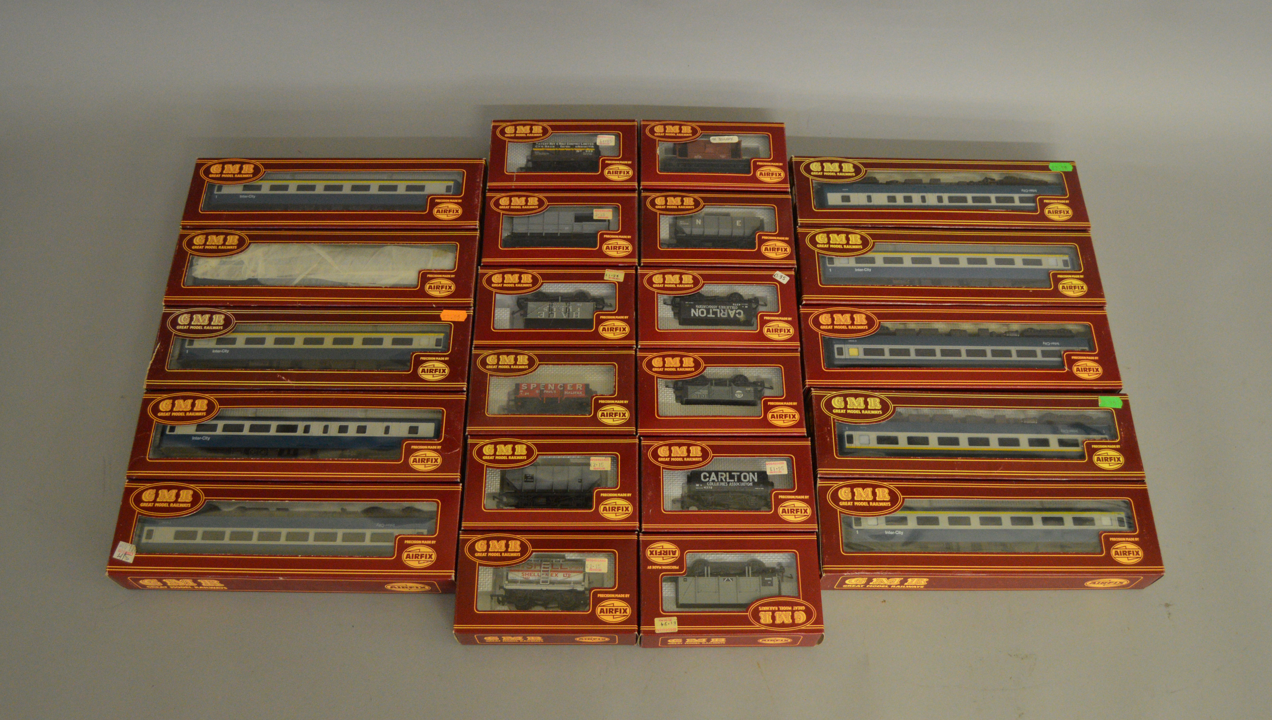 OO Gauge. 10 boxed GMR blue and grey Coaches of various types  together with 12 assorted GMR Wagons,