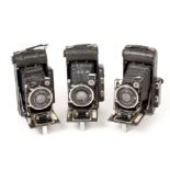 Three Ensign Autorange 120 Folding Cameras. Various lens & shutter combinations, including one