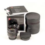 Black Leica Summilux-M 28mm f1.4 ASPH Lens. #4206082. With hood, caps, pouch, instructions etc in