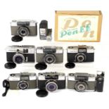 Eight Olympus Half Frame Cameras. Comprising Pen EEn, boxed with flash, filters, case etc.; Pen S (