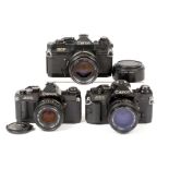 Three Canon Film Cameras, Two with 50mm f1.4 Lens. Comprising Black Canon EF #220087 with breech-