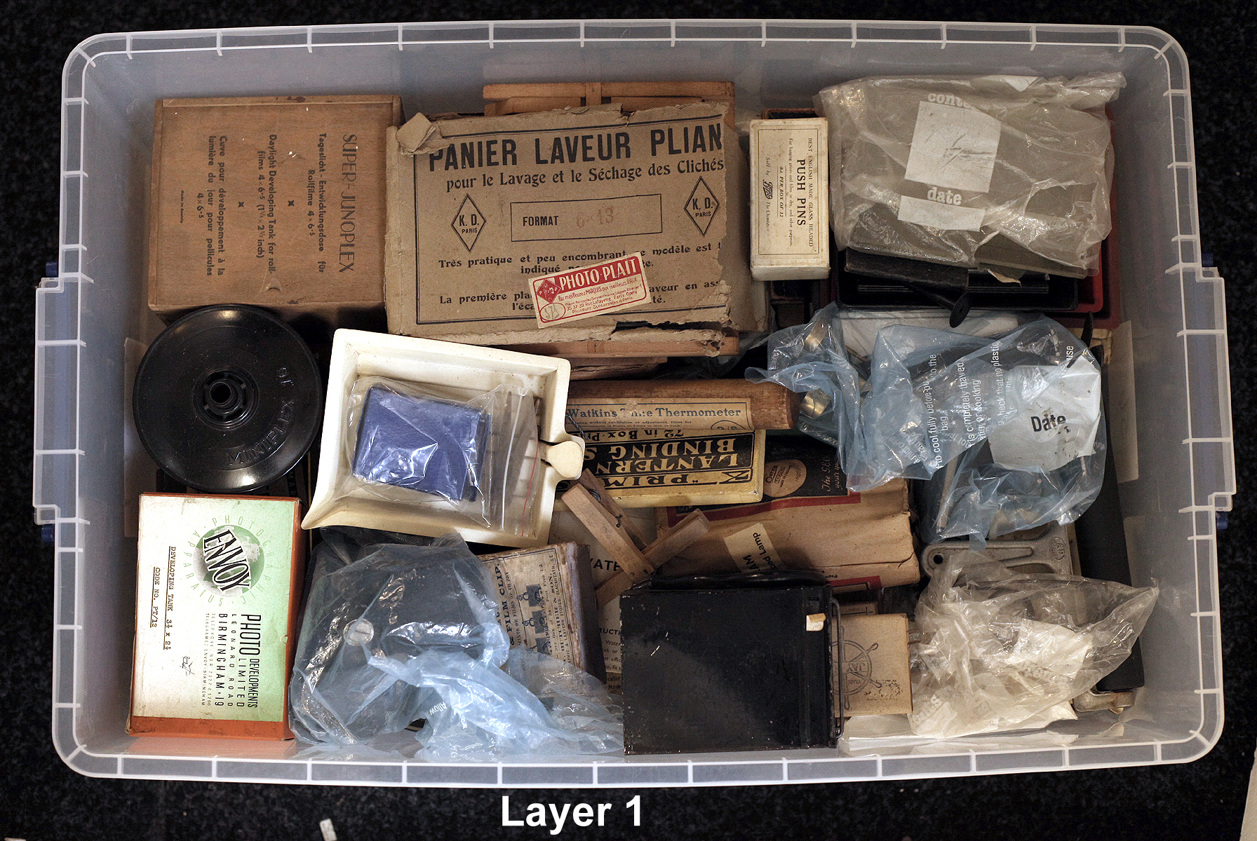 A LARGE Plastic Crate of Early to Mid-20th Century Developing Equipment. To include Bakelite and