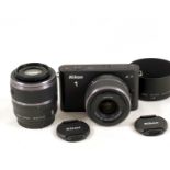 Nikon J1 Mirrorless Digital Camera Set.