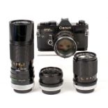 Black Canon FTb QL 4-Lens Outfit. Comprising body #369124 with FD 50mm f1.4 lens (condition 5F) &