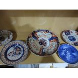 Four Imari plates and one other