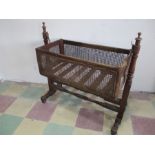 A Victorian swinging crib with cane sides A/F