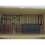 A collection of leather bound books etc.