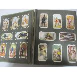 An album of cigarette cards including Ogden's and Churchman's etc.