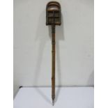 A French bamboo and metal shooting stick with cane seat, stamped BTE S.G.D.G