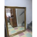 A large gilt framed mirror