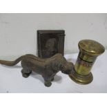 A 19th century wall mounted rush holder along with a brass money bank in the form of a post box