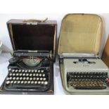 An Underwood vintage typewriter along with an Olivetti Lettera 22 portable typewriter