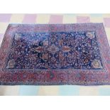 A blue ground rug - approx 210cm x 130cm