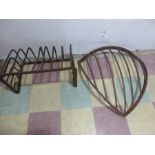 Two cast iron hay racks