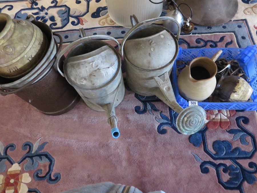 Two galvanised watering cans, bucket, one other similar and three pieces of pottery