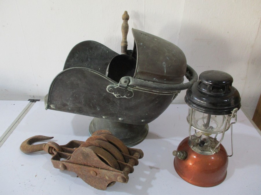 A cast iron pulley, Tilley lamp and a copper coal helmet ( A/F)