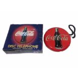 A Coca Cola blink disc telephone