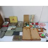 A collection of various fishing equipment including lures and fly tying equipment etc