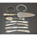 A Sterling silver tea spoon, silver handled cutlery, silver bangle etc.