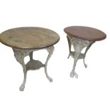 A pair of cast iron pub tables with mismatched mahogany tops, the bases cast by Brownlow & Co.