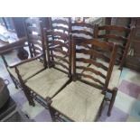 A set of six oak ladder back chairs