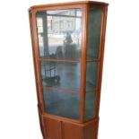 A mid century corner display cabinet