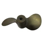 A small bronze "Michigan machine pitched propeller" in box