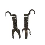 A pair of Arts & Crafts style wrought iron adjustable candlesticks/ rush holders of barley twist