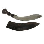 A Kukri knife, the blade stamped C I, G,1916 and 43, in leather scabbard