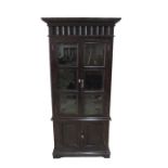 A large dark wood display cabinet with cupboard under