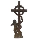 A cast iron cross with cherub - 82cm H