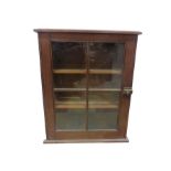 A small glass fronted display cabinet