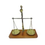 A Doyle & Sons, London balance scale on wooden plinth