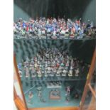 A large collection of hand painted model Napoleponic soldiers, along with a collection of related