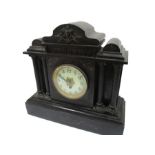 A slate mantle clock with column detailing