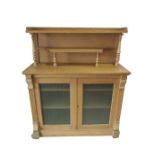 An antique pine chiffonier