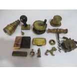 A collection of various small metal items including miniature telescope, fishing reels, lighter,