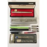 A collection of 5 Parker pens along with extra nibs, cartridges etc.