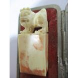 A cased early 20th Century ivory seal topped with a Dog of Fo